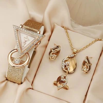 Ensemble bijoux et montre dorés