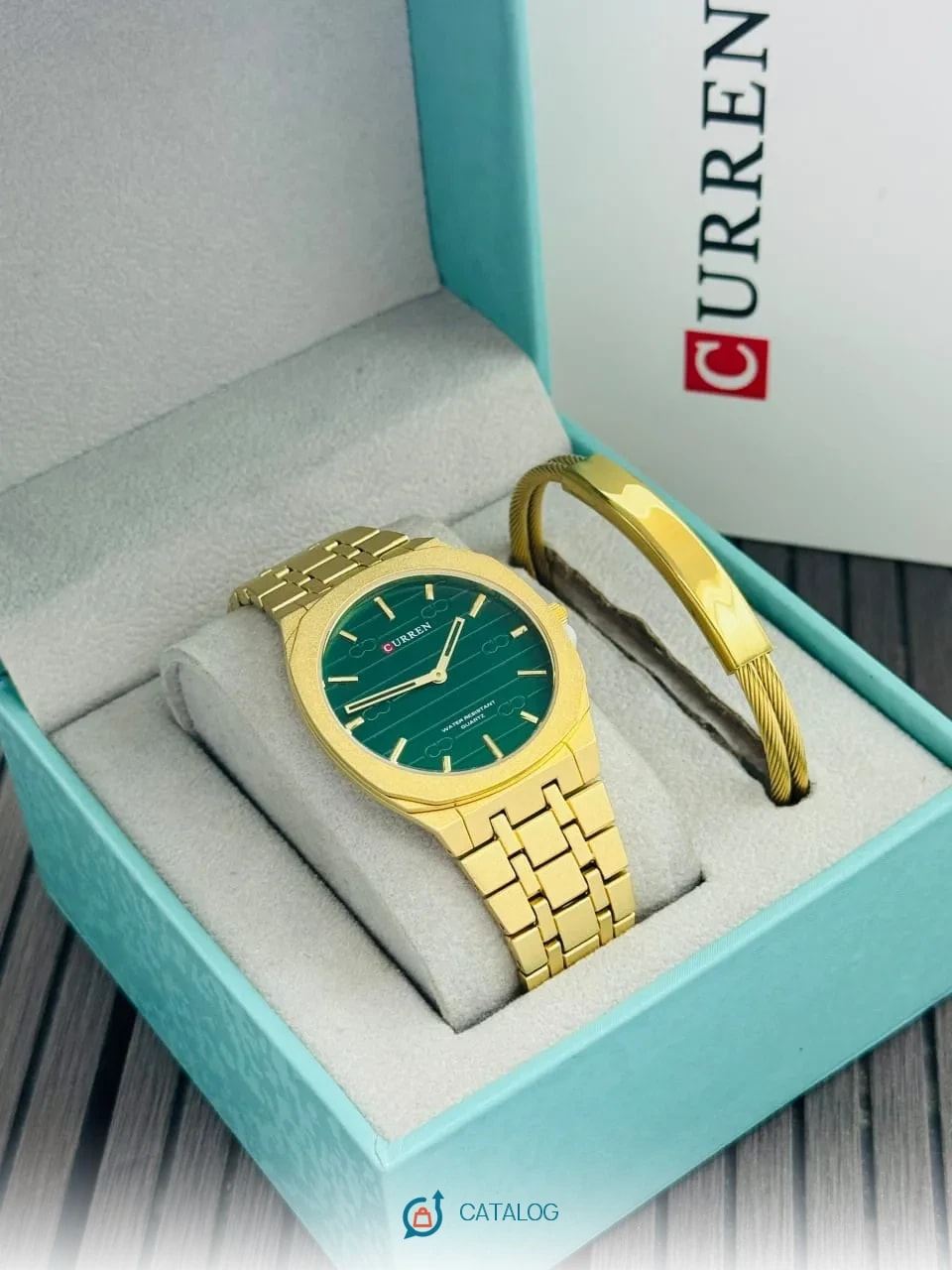 Montre dorée cadran vert et bracelet